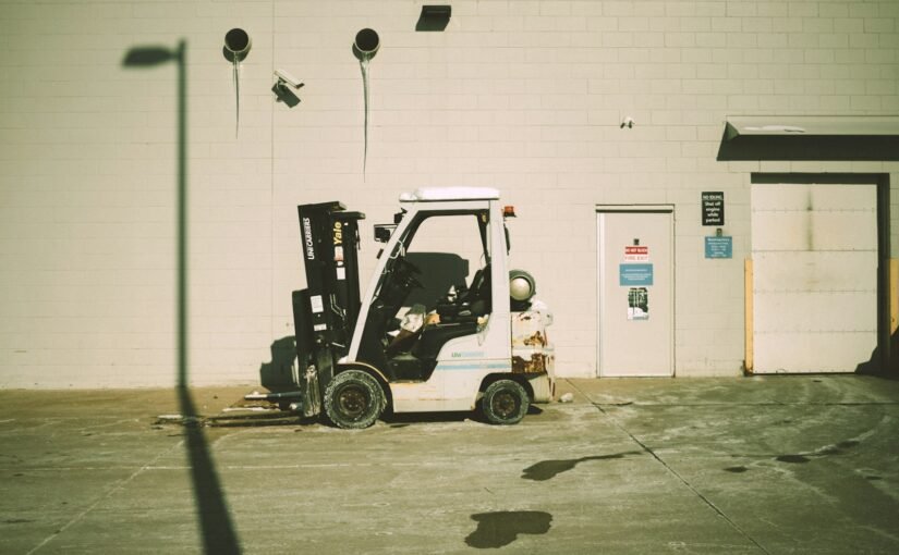 a forklift parked in front of a building